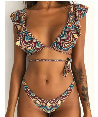 Yellow floral print split bikini swimsuit set with top and pants on a mannequin.