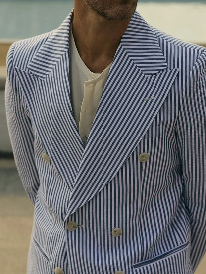 Blue and white striped polyester suit set with blazer and pants on mannequin