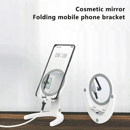 Adjustable mobile phone stand with integrated makeup mirror, featuring a sleek and versatile design for hands-free use and on-the-go touch-ups.