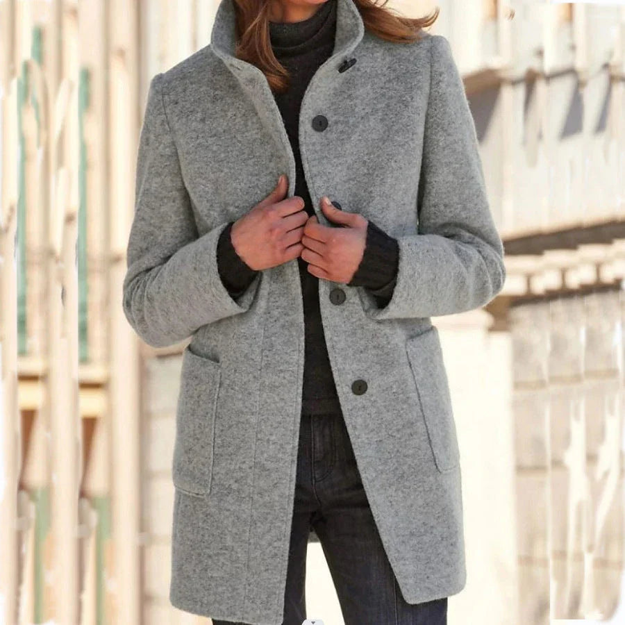 Fashionable woolen coat with stand collar, pockets, and button closure for women's fall and winter outerwear