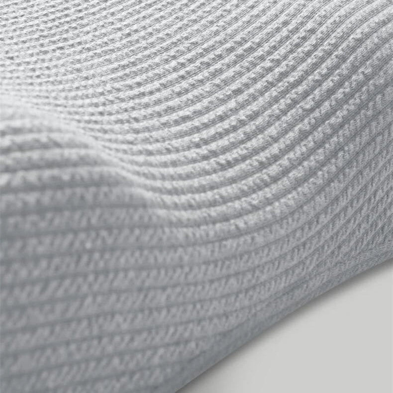 Premium memory foam neck massage pillow with adjustable loft and breathable knitted cotton cover for comfortable, pain-relieving sleep