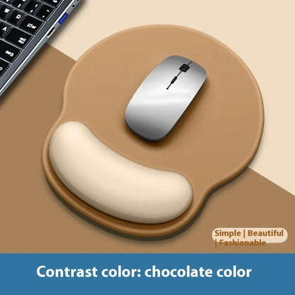 Silicone mouse mat with wristband in a gradient blue black colour pattern on a desk.