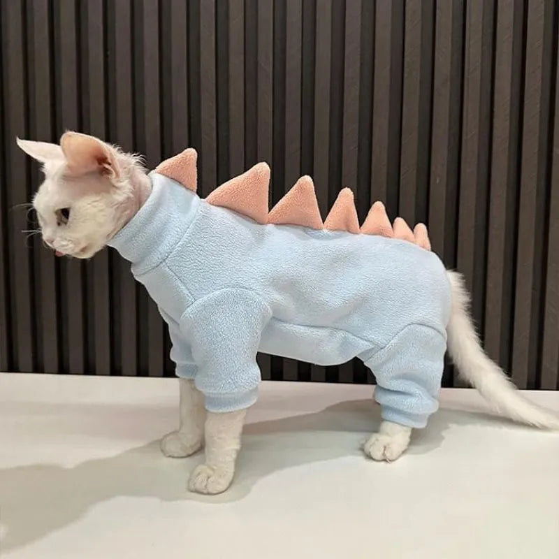 Dinosaur costume on hairless Sphynx cat showing fleece material and decorative spikes