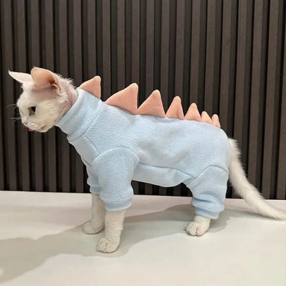 Dinosaur costume on hairless Sphynx cat showing fleece material and decorative spikes