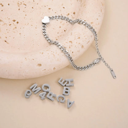 INS Commuter's necklace with 40.5cm titanium steel chain and electroplated gold or silver charms for personalisation
