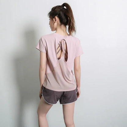Women's pink short sleeve polyester sports T-shirt for fitness and running.