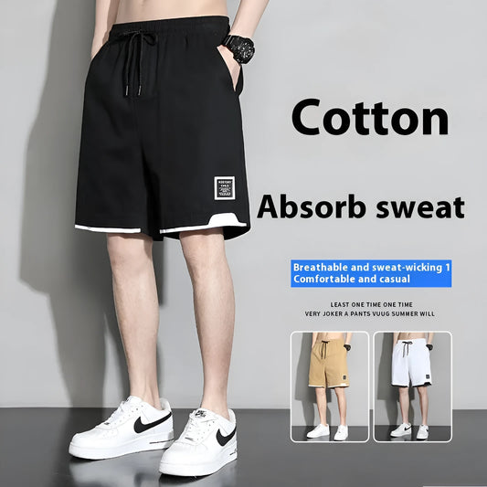 Cotton shorts for teenage boys in black, shown on a hanger, featuring a mid-waist design.