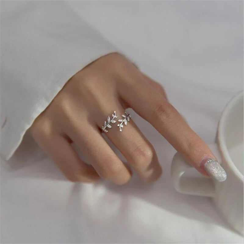 Women's fashion branch ring with leaf design in silver and gold finishes