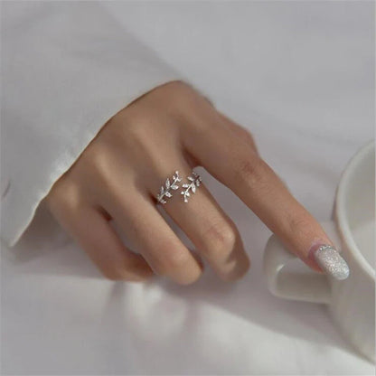 Women's fashion branch ring with leaf design in silver and gold finishes