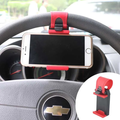 Black steering wheel phone holder with 75mm clip mounted on car wheel holding smartphone