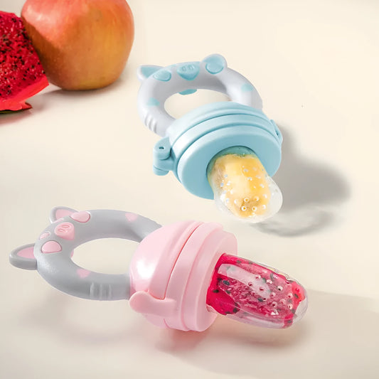 Blue, green, and pink silicone baby teethers with textured surfaces for chewing.