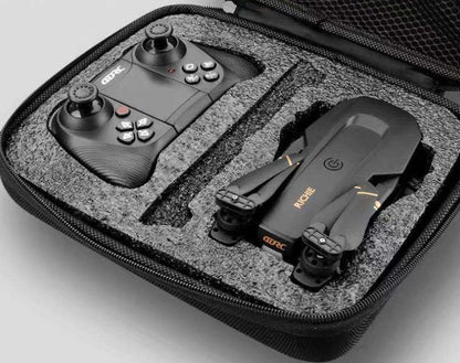 Black folding drone with 4K camera, protective frames, and remote control on grey background