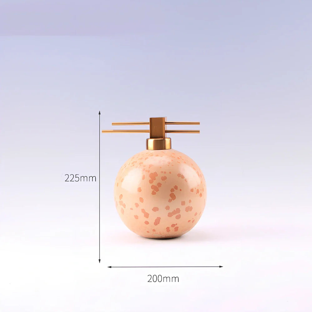 Handmade ceramic ornaments in graduated sizes with emerald green and golden sunlight glazes