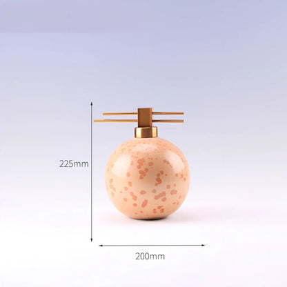 Handmade ceramic ornaments in graduated sizes with emerald green and golden sunlight glazes