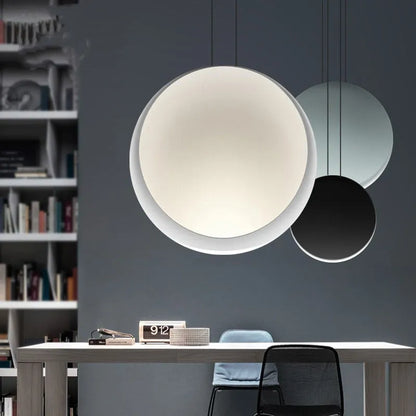 Round resin cosmos chandelier light with adjustable hanging height, shown in a bedroom setting.
