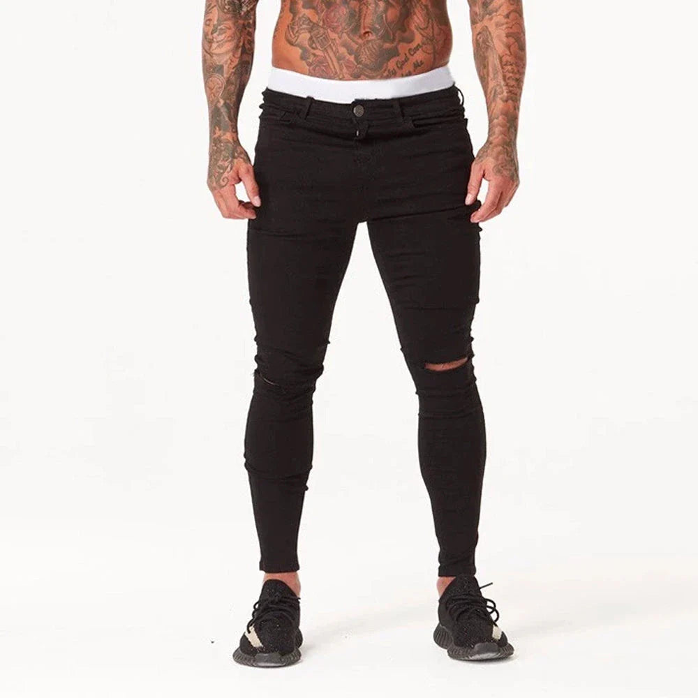 Premium Distressed Men's Skinny Jeans in Black, featuring a skinny silhouette and trendy distressed details for a casual cool style.