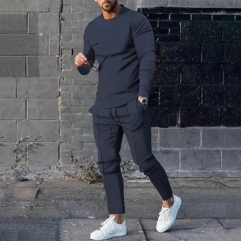 Men's light grey polyester two-piece suit set with long sleeve round neck T-shirt and matching trousers.