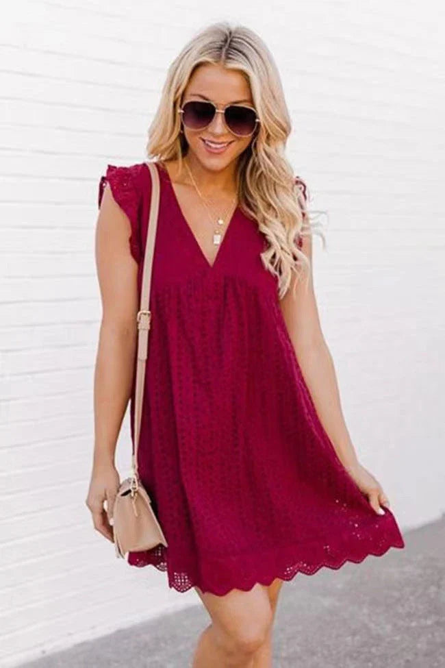 A sleeveless summer dress with a unique jacquard design, lace details, and pockets in various colors