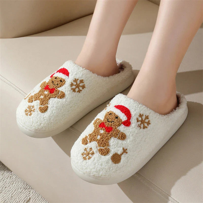 Cozy plush gingerbread slippers with festive snowflake patterns, designed for comfortable indoor wear during the winter season.