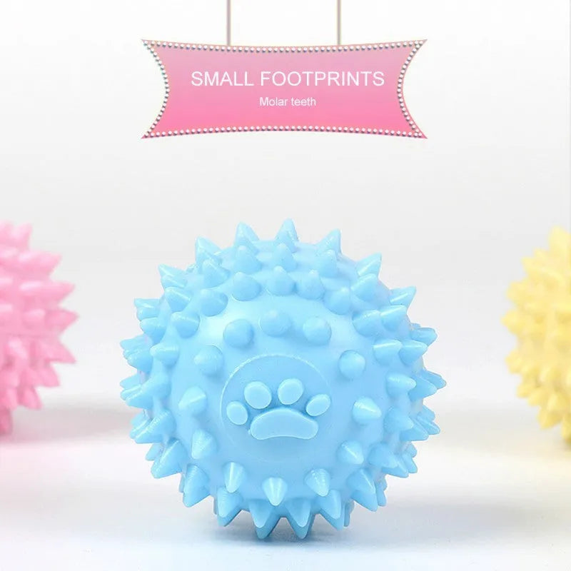 Blue TPR dog chewing toy ball with footprint design and tooth-cleaning bulges