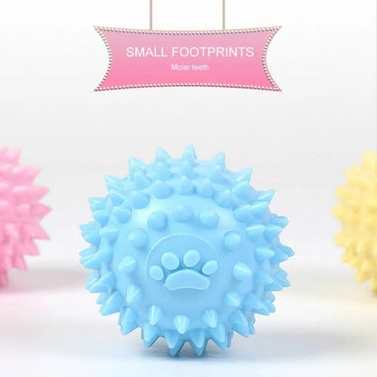 Blue TPR dog chewing toy ball with footprint design and tooth-cleaning bulges