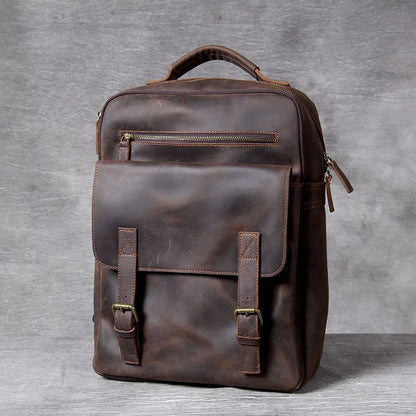 Dark coffee coloured retro leather backpack made from first layer cowhide with organised interior pockets.