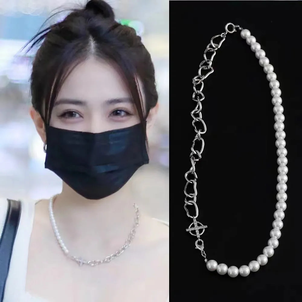 White geometric acrylic asymmetric clavicle chain necklace on a twisted chain.