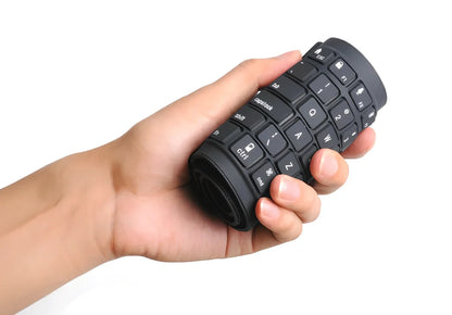 Black foldable silicone Bluetooth keyboard showing compact 105mm folded width and full 108-key layout