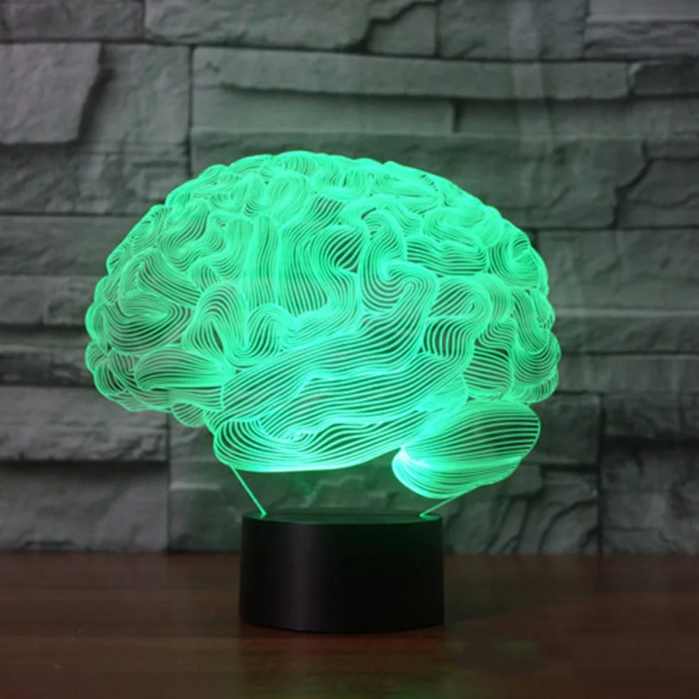 3D brain-shaped LED lamp with colour changing modes and remote control on wooden surface
