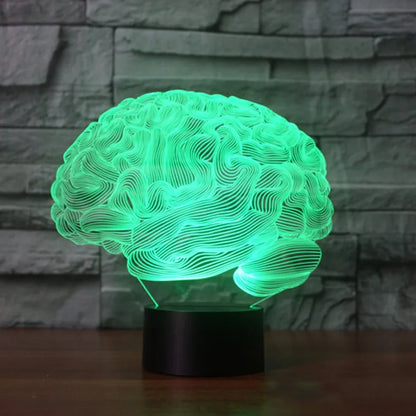 3D brain-shaped LED lamp with colour changing modes and remote control on wooden surface