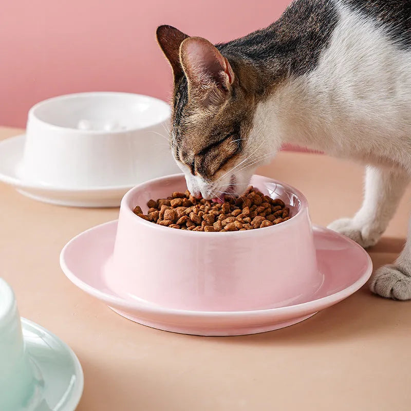 Green ceramic slow feeder bowl for pets with high walls and a non-slip rubber base.