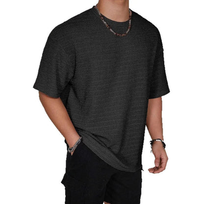 Men's slim-fit solid colour short sleeve T-shirt on a hanger, showing lightweight fabric.