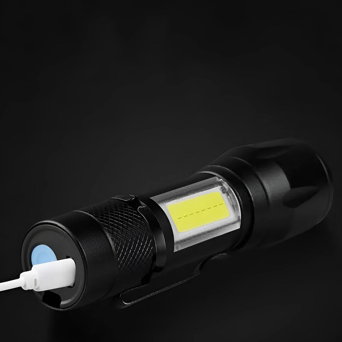 Black USB rechargeable LED flashlight with 10W output and aluminium alloy body, pocket-sized torch for hiking and camping.
