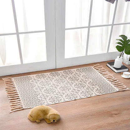 Hand-woven Scandinavian style linen cotton rug with woven tassels in plant-dyed colours measuring 60x90cm