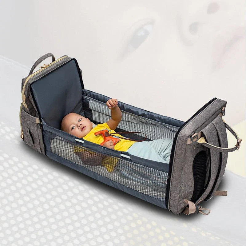Versatile baby changing backpack with USB charging port and folding portable bed