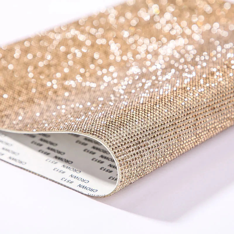 Rhinestone sticker net on backing sheet for hot drilling application to fabrics in multiple colour options