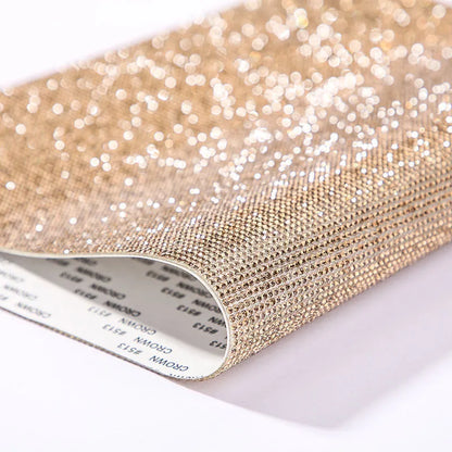 Rhinestone sticker net on backing sheet for hot drilling application to fabrics in multiple colour options