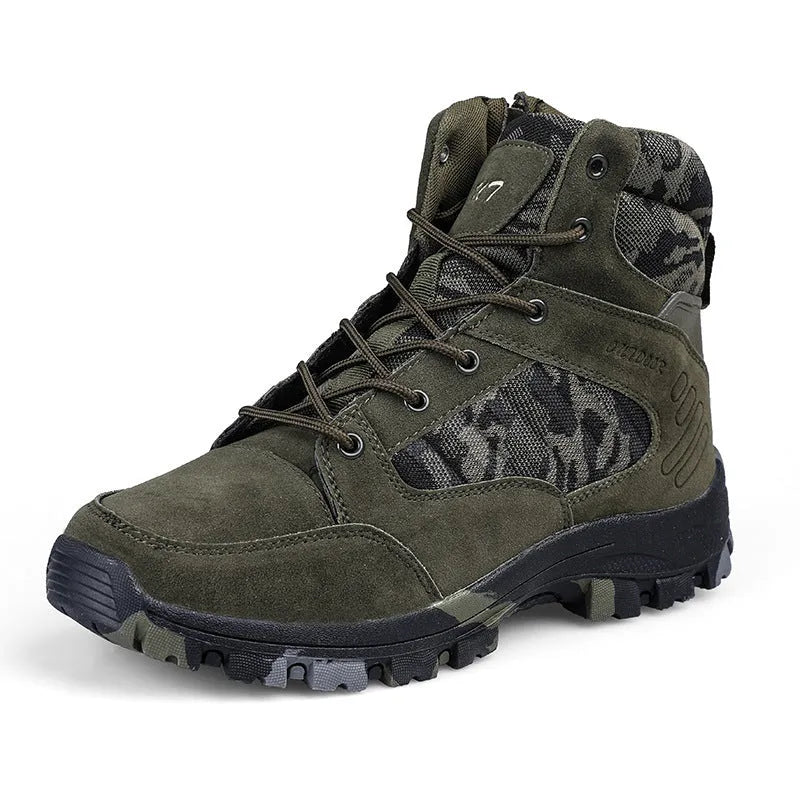 Men's black and camouflage high-top hiking shoes with PU upper and metal eyelets on a rocky outdoor path.
