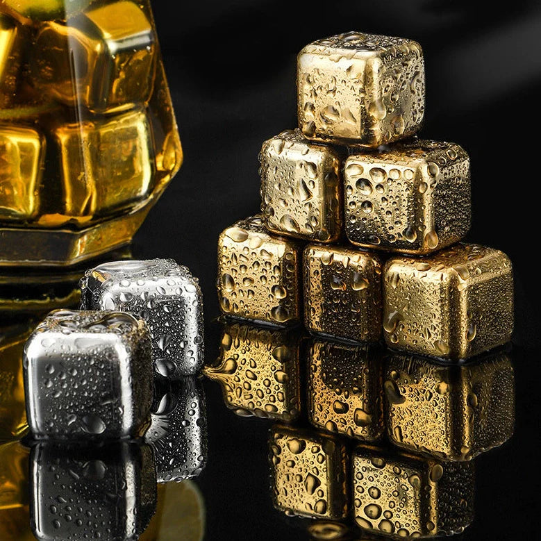 Stainless steel ice cubes in gold and silver finishes with tongs for chilling drinks without dilution