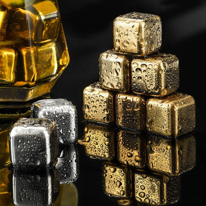 Stainless steel ice cubes in gold and silver finishes with tongs for chilling drinks without dilution