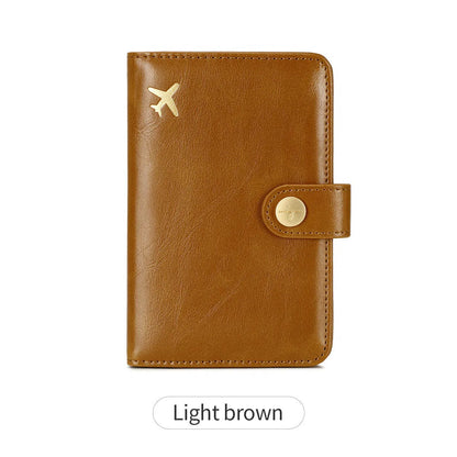 Simple PU leather passport holder in sapphire blue with visible sewing lines, showing card slots and RFID protection.