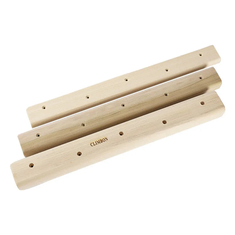 Three solid wood hangboards for grip strength training showing different edge depths and lengths