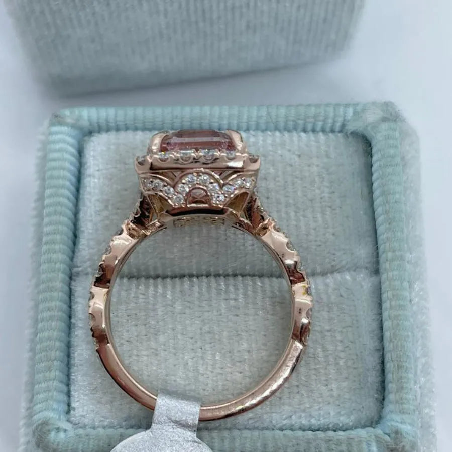 Rose gold electroplated geometric alloy ring on a white background.