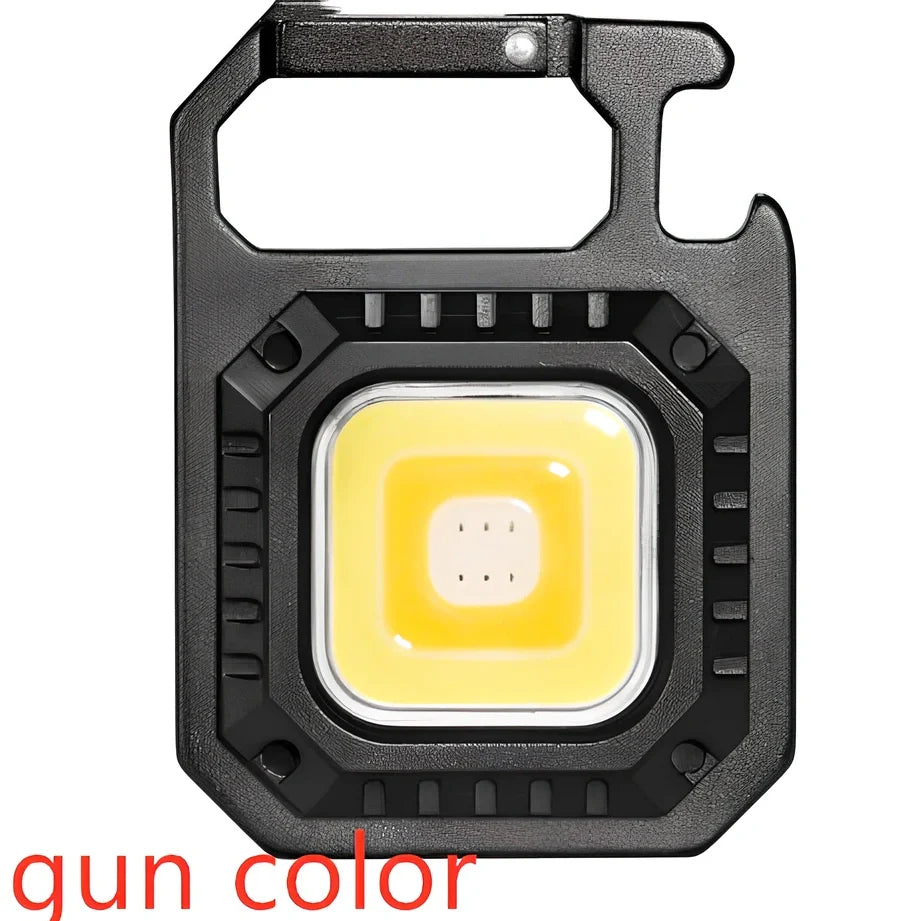 Black portable LED torch showing magnet, bottle opener, and multiple light modes with 500lm brightness