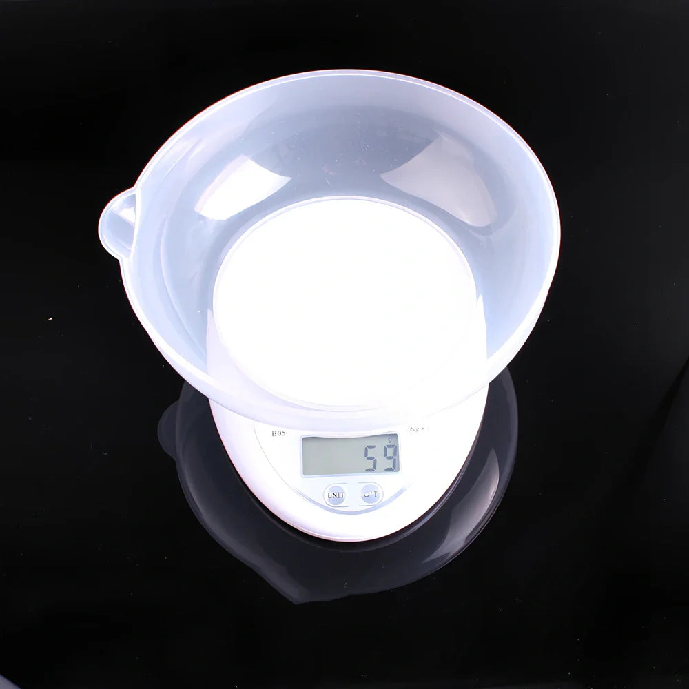White electronic kitchen scale with digital display showing 1g precision and 5kg capacity measurements