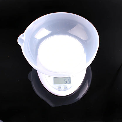 White electronic kitchen scale with digital display showing 1g precision and 5kg capacity measurements