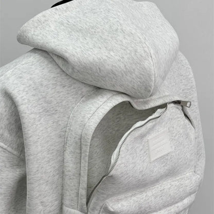 Light grey men's backpack design hooded coat jacket on a hanger.