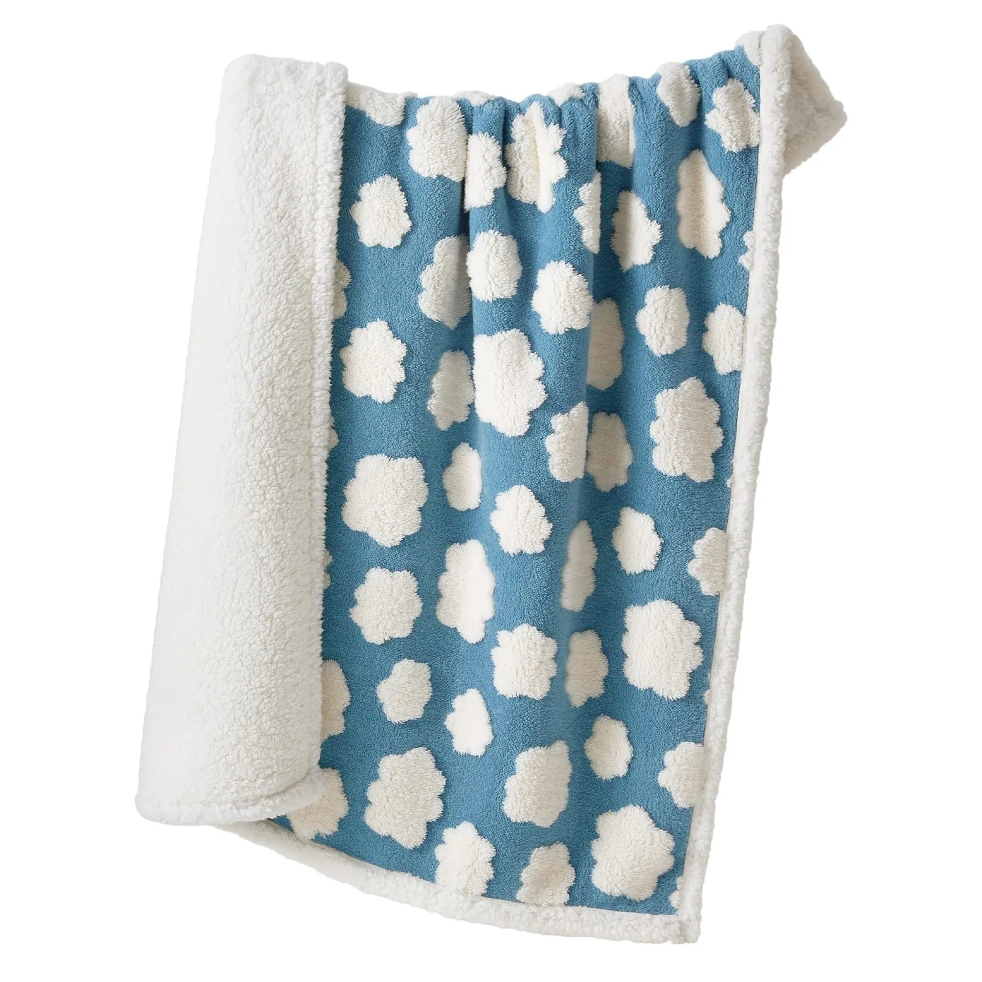 Blue and white patterned waterproof dog blanket on furniture showing cloth texture
