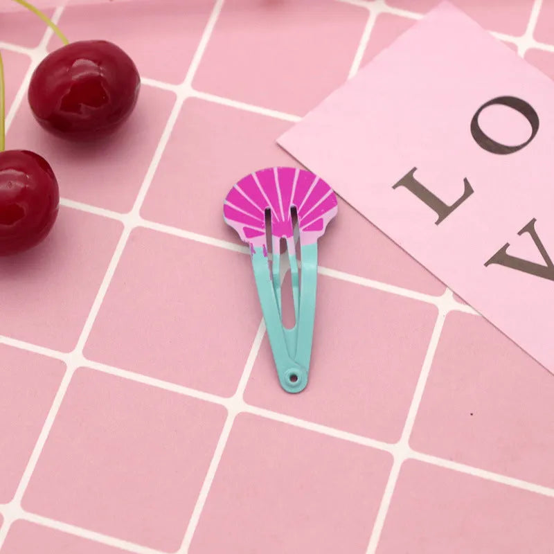 Colourful metal hair barrettes for children with printed watermelon, strawberry, pineapple and Christmas designs.