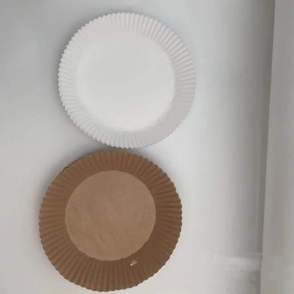 Disposable air fryer liners made of durable, food-grade parchment paper for effortless cleanup and healthy cooking